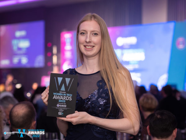 Female entrepreneur holding business award at the West Midlands Tech Awards